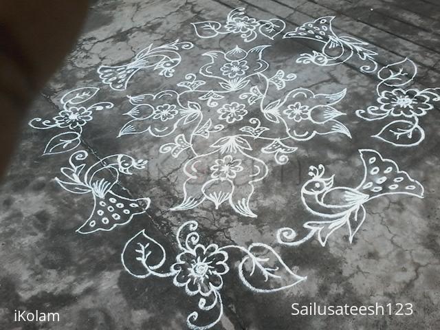Rangoli: Flower kolam with peacocks Rangoli: Flower kolam with peacocks