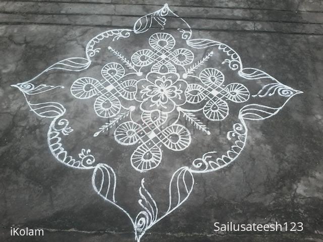 Rangoli: Chikku with flower Rangoli: Chikku with flower